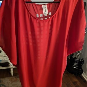 Burgundy blouse with cross cutout on the back.